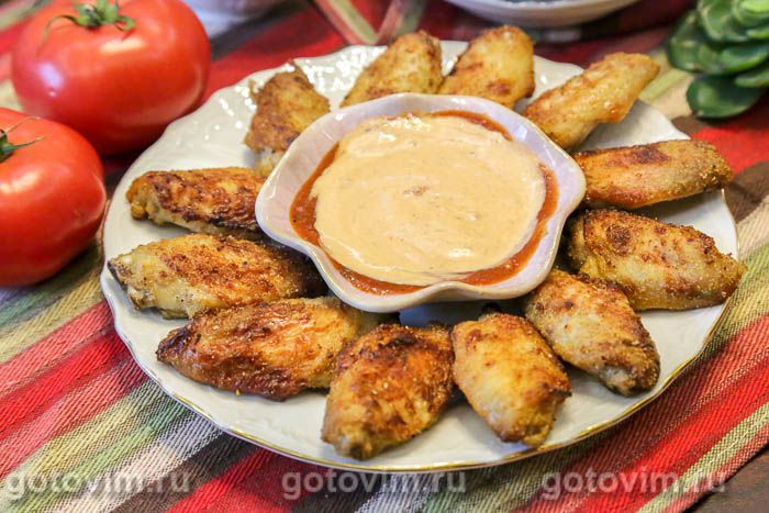 Куриные крылышки в с чесноком и разрыхлителем в духовке. Фотография рецепта Куриные крылышки в с чесноком и разрыхлителем в духовке. Фотография рецепта